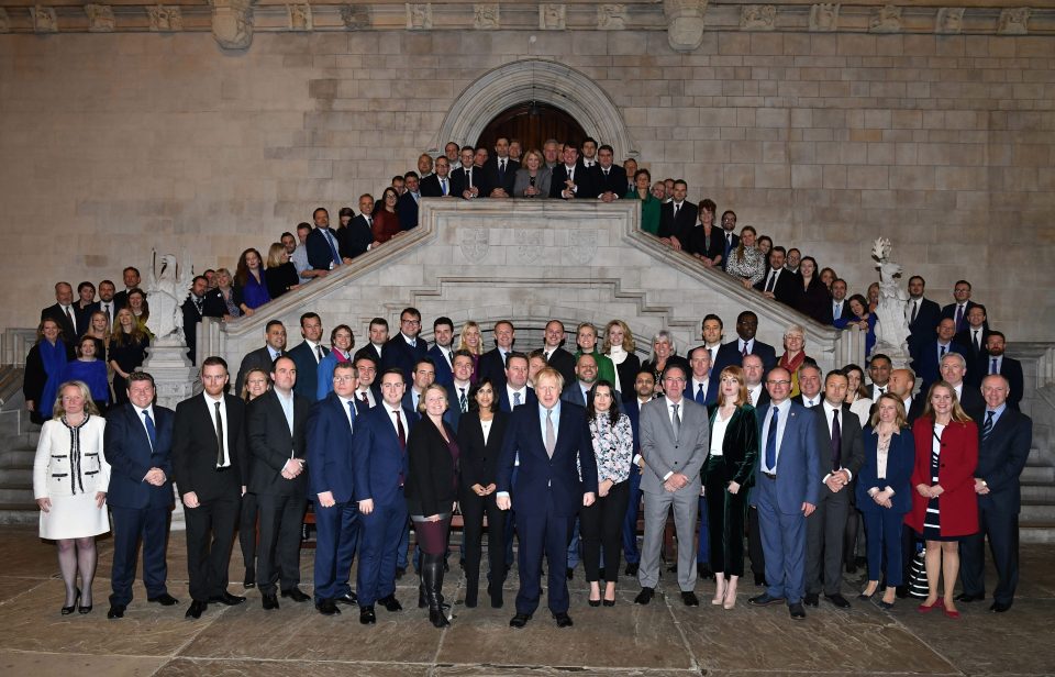  The Prime Minister could not hide his pride as he posed with his newly-elected MPs on their first day in office