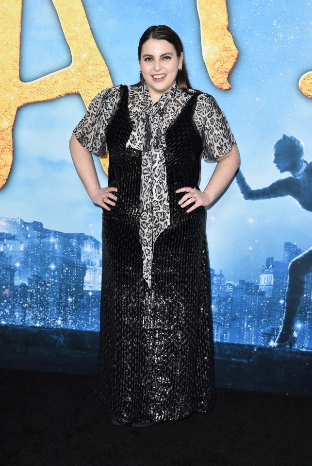 Beanie Feldstein walked the black carpet in a printed dress