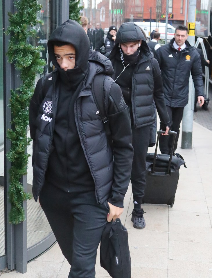  Young striker Greenwood wrapped up warm on the December afternoon