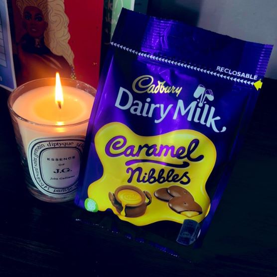  Rylan later shared a picture of a candle and a pack of Cadbury Nibbles