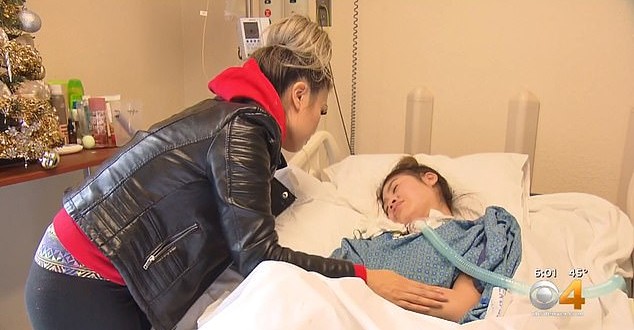 Lynn Fam visits her daughter at the hospital daily to brush her hair and fluff her pillows