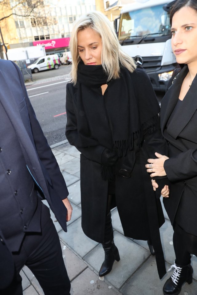  The star wore a black coat, scarf and boots as she arrived with an unknown woman