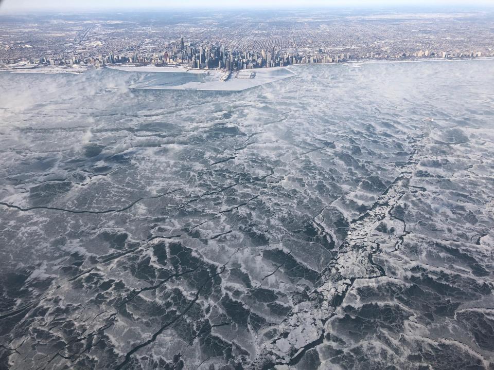 A completely frozen Lake Michigan and the city of Chicago