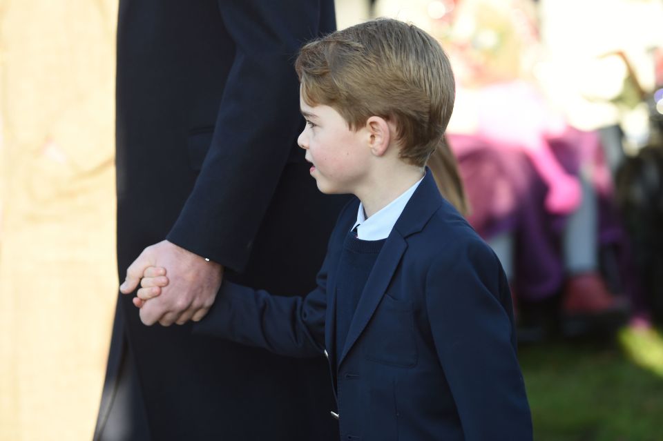  Prince George held dad William's hand on the way to the church