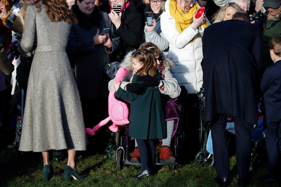  Charlotte hugs a member of the public as she spreads some festive joy