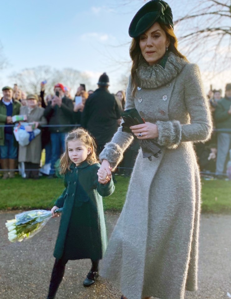  Kate holds her daughter's hand, as she clutched a bouquet of flowers