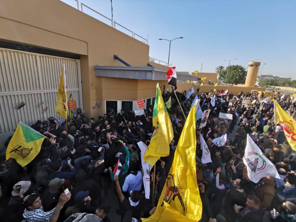  The mob broke down the gate at the US embassy in Baghdad and stormed inside the compound