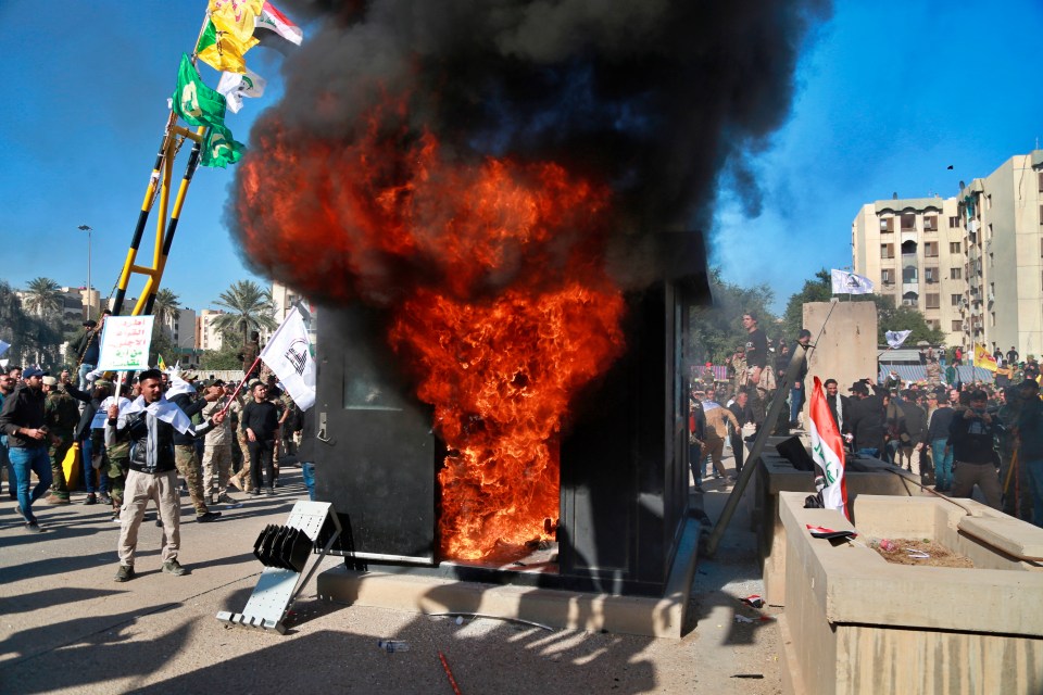  They smashed down gates and set fire to a guard post