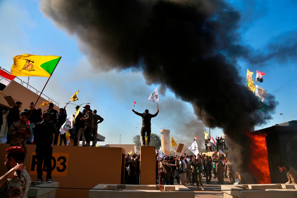  A huge plume of black smoke rises over the US embassy in Baghdad today