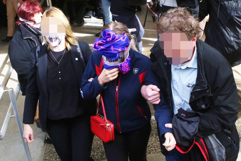  The teen and her mum wore masks with stitches on the lips as they left court in protest at her treatment