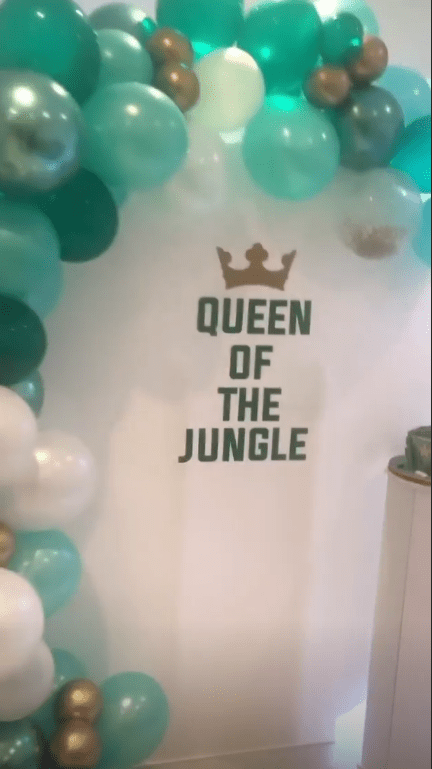  Another set of balloons covered the kitchen wall, where a sign said 'Queen of the Jungle'