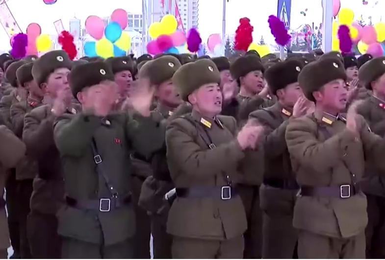  Fawning North Korean troops cheers on their leader in the snow