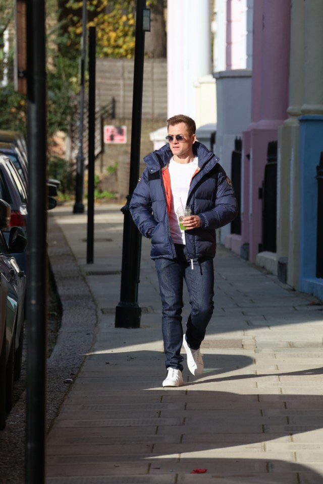  Taron looked dapper at the Globes - a far cry from his normal casual look, snapped here in London in November