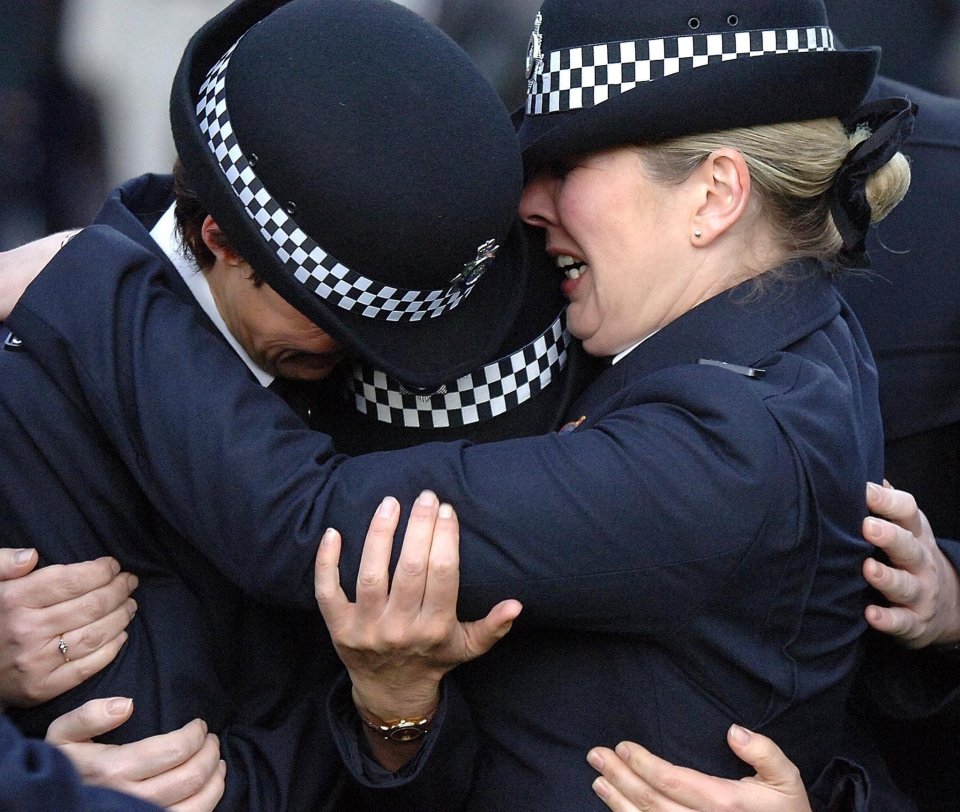  PC Teresa Milburn is consoled by colleagues at a memorial service in 2006