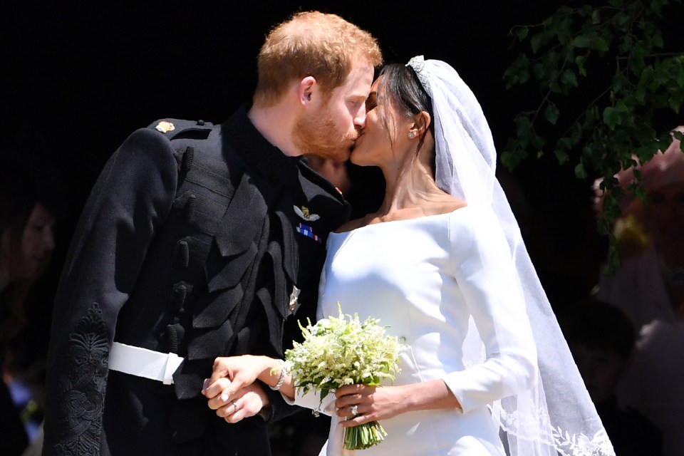 Harry and Meghan kiss after their marriage in Windsor Castle in 2018