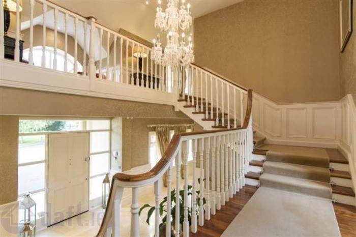 The entrance to the property features crystal chandeliers