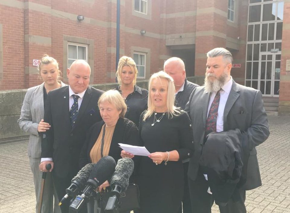  Joy reads a statement outside court, surrounded by her family, after Mavis was cleared