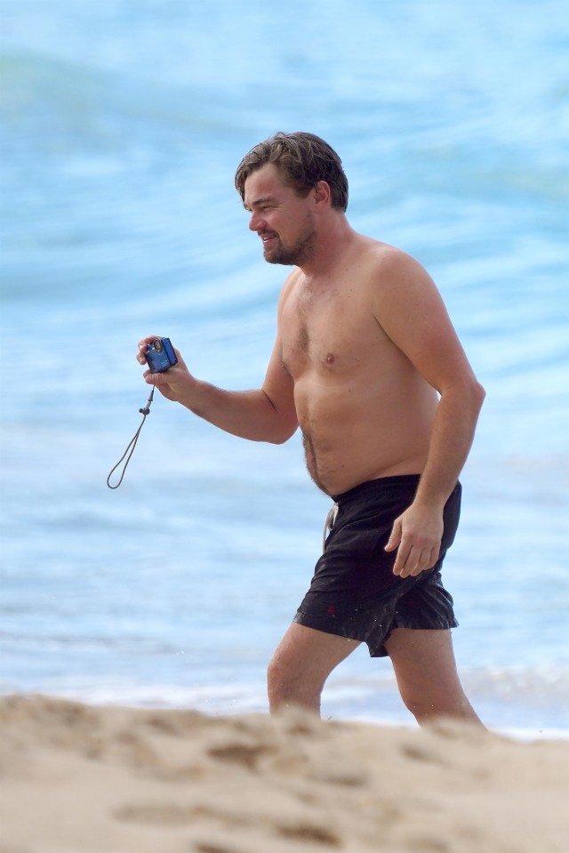  Leo opted for a casual look in a pair of swimming shorts