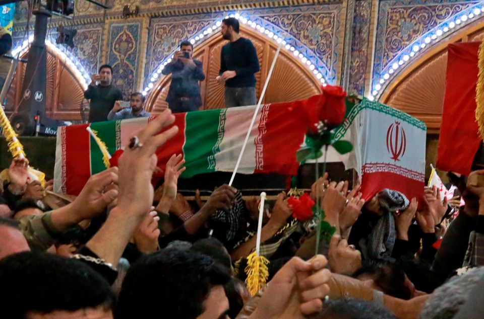  Mourners carry the coffins of Iran's top general Qassem Soleimani and Abu Mahdi al-Muhandis