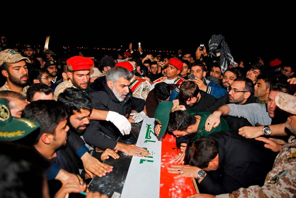  Locals carry the casket of Iranian commander Qasem Soleimani upon arrival at Iran's Ahvaz International Airport