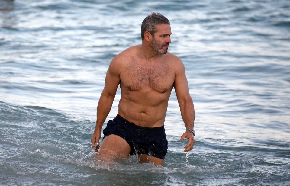 Andy Cohen showed off his ripped abs hanging on the beach in Miami