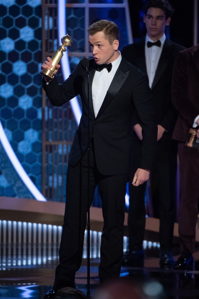  The actor was whisked onto the stage to collect his gong