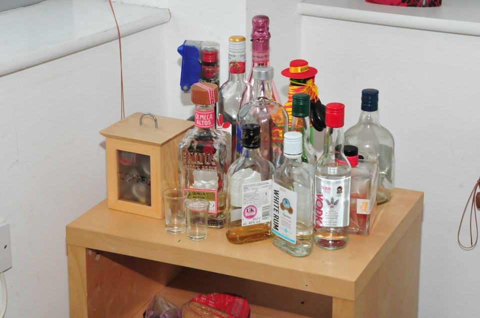  Empty drinks bottles were found littered throughout the flat