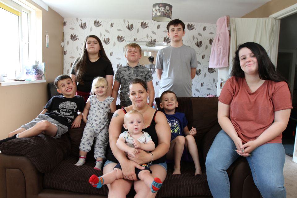  Sonya poses with her kids at their Southampton flat