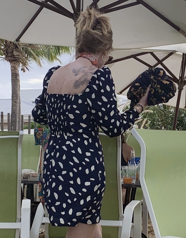  She showed off her rarely seen back tattoos