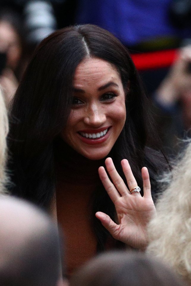  Meghan waved to crowds as she walked into Canada House following the couple's Christmas break