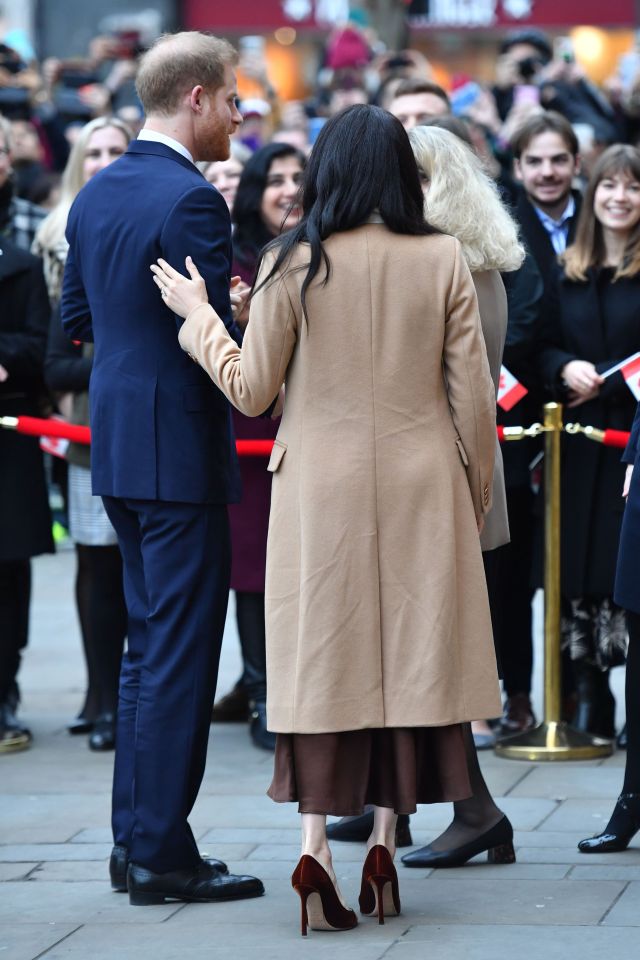  The pair looked happy and kept touching each other as they walked into the High Commission