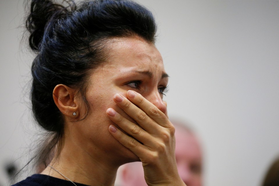  A woman fights back tears as she waits for news at Kiev Airport