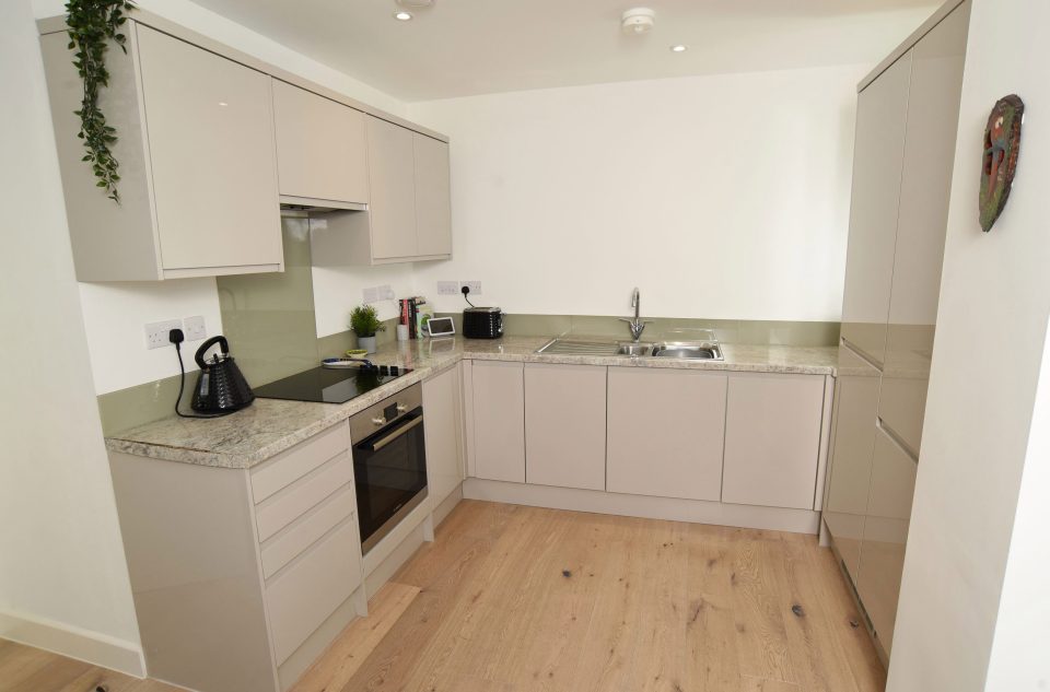  The kitchen opens up into the living room in the flat