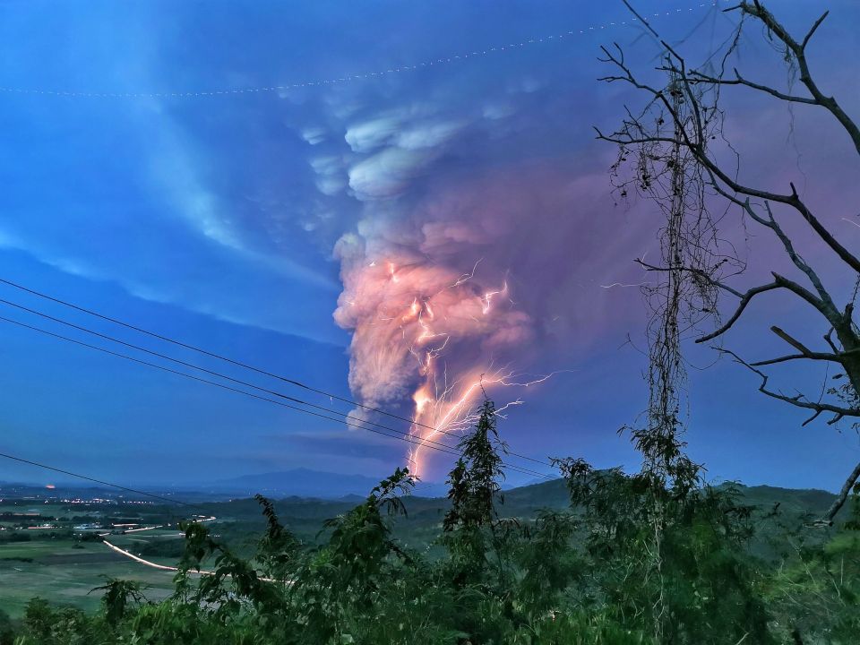  A terrifying cloud of ash is lit up by rare volcanic lightning