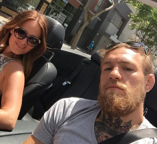 McGregor takes girlfriend Dee Devlin for a spin in one of his expensive motors