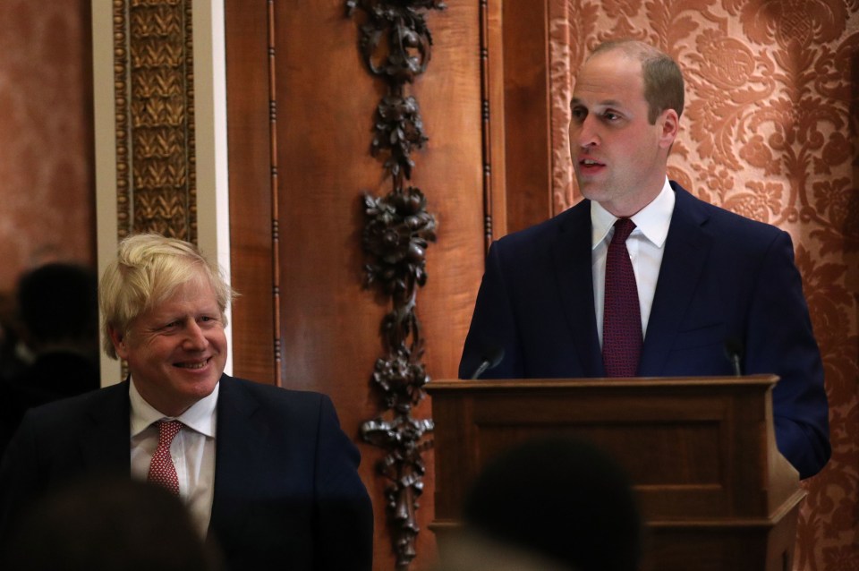 The Duke of Cambridge delivers his speech next to a grinning Boris Johnson