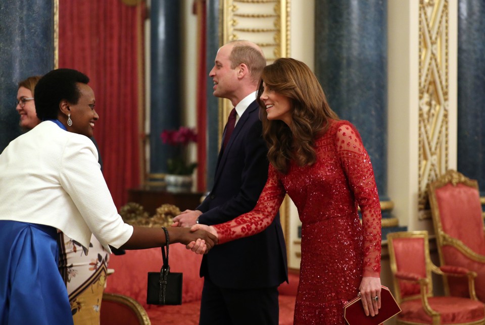 The Duke and Duchess of Cambridge greet guests inside Buckingham Palace