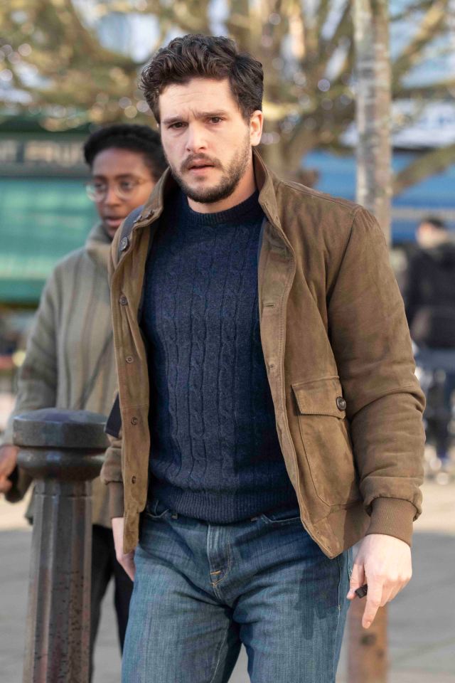  Kit looked dapper in a blue jumper and brown coat