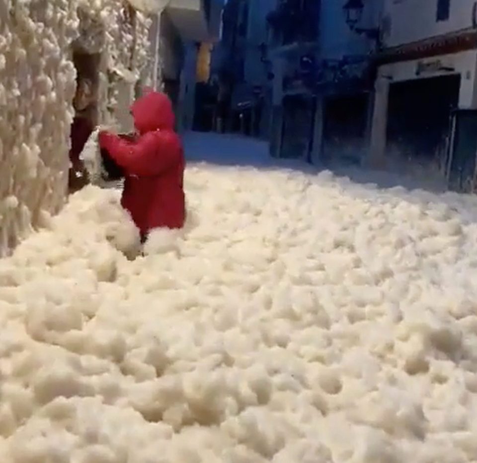  Bizarre sea foam 'drifts' were whipped up by storms in towns along the coast