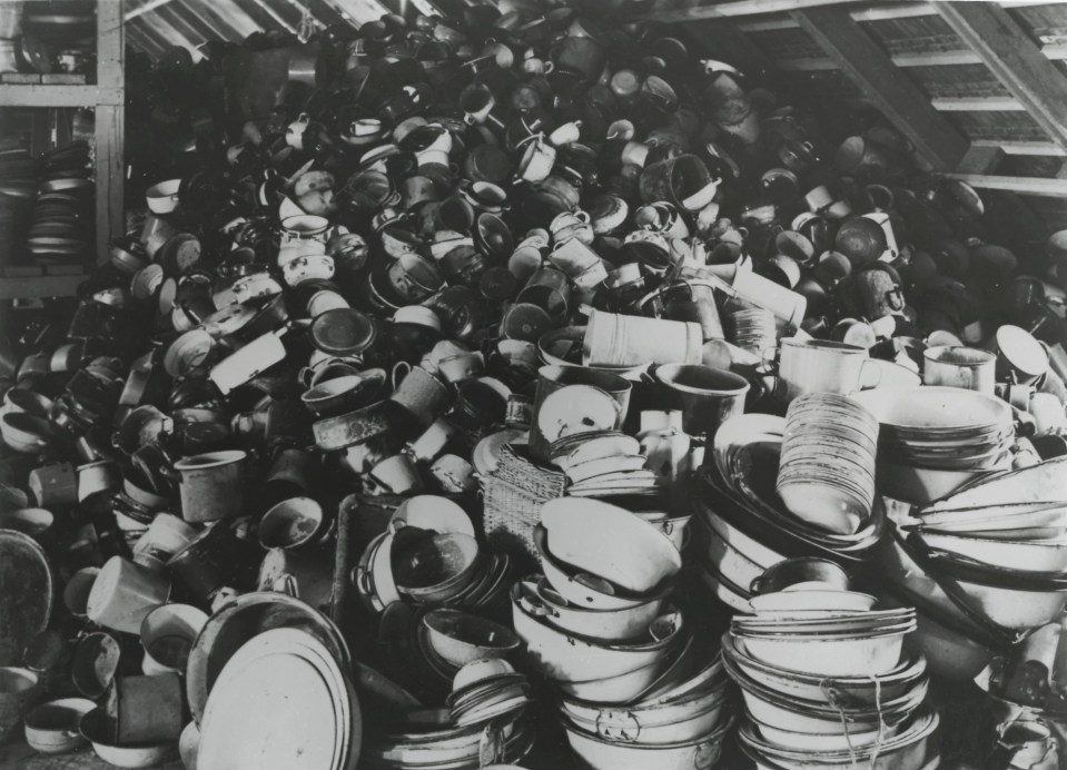 Piles of pans and pots brought by people with no idea about what was about to happen to them