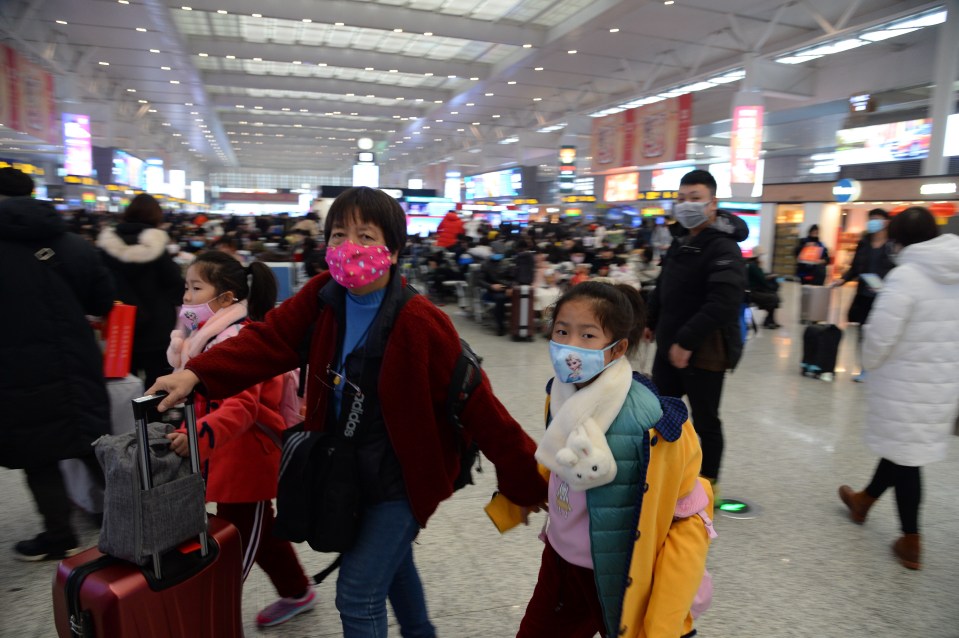  Passengers at Hongqiao Railway Station in Shanghai wearing masks as peak spring festival travel period gets underway