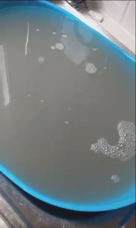 A mum has revealed the dirty water generated by her washing machine after she used a cleaning product on an empty cycle