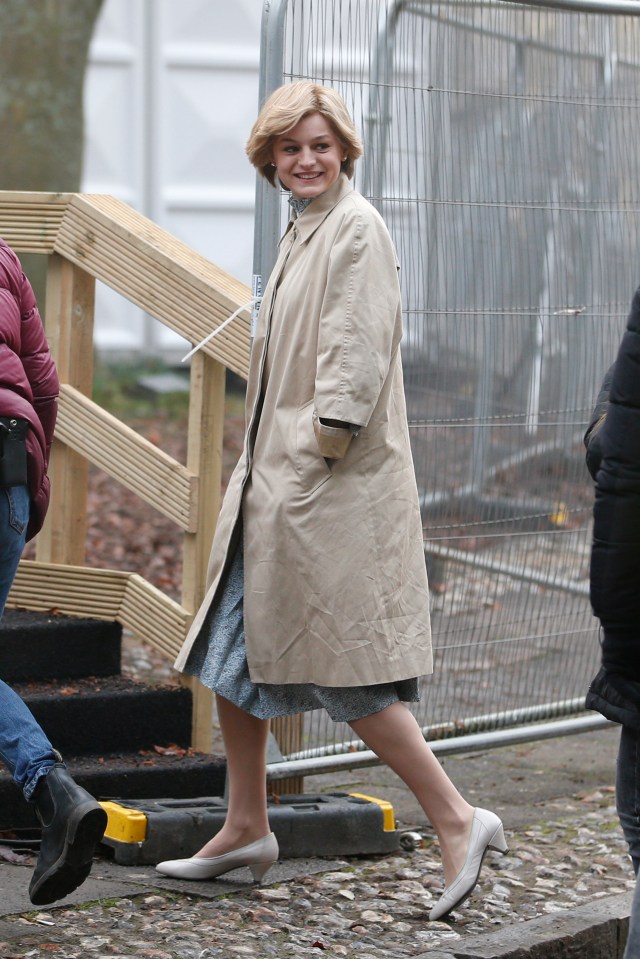  Emma wore a beige coat over a pale blue dress with cream small heel pumps