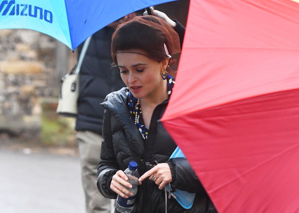  The actress plays Princess Margaret and had her hair do covered with a net to protect it from the elements