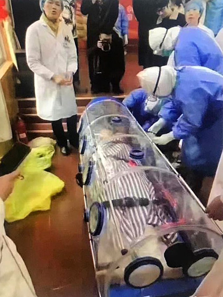  The deadly coronavirus has already infected 10,000 people in China - here one victim is wheeled into a hospital in Huizhou sealed in a plastic tube