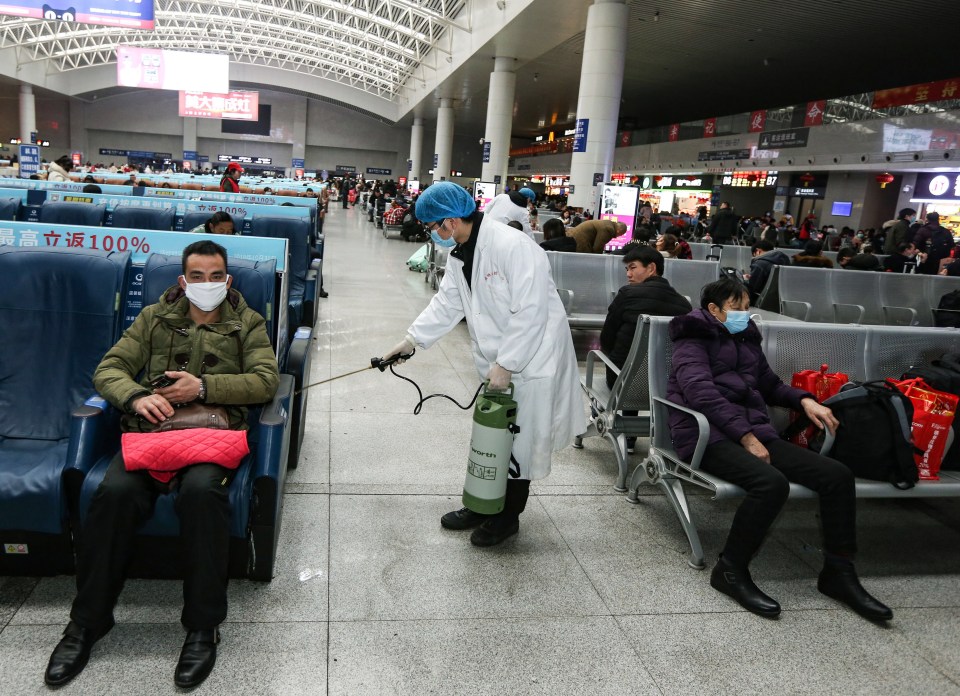  A worker disinfects a railway station in China after a virus has infected more than 600 people in the country