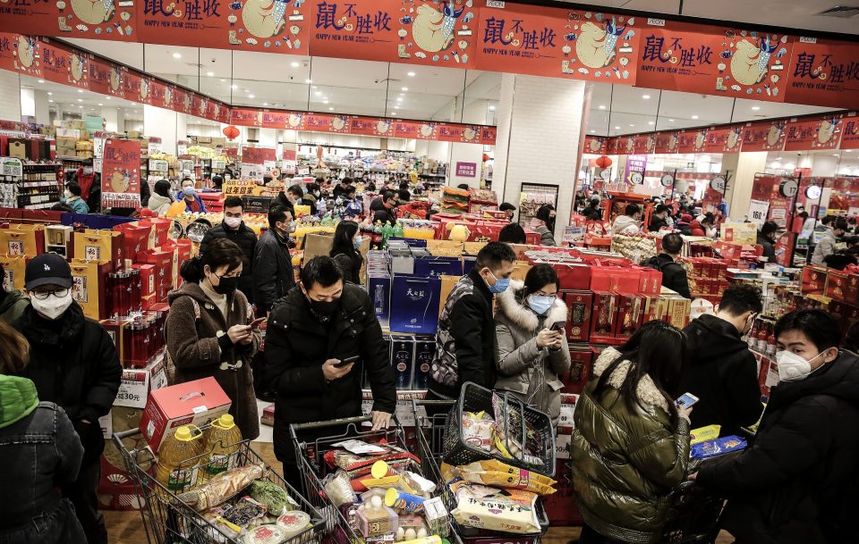  Wuhan residents buying goods in the supermarket as the city was put on lockdown