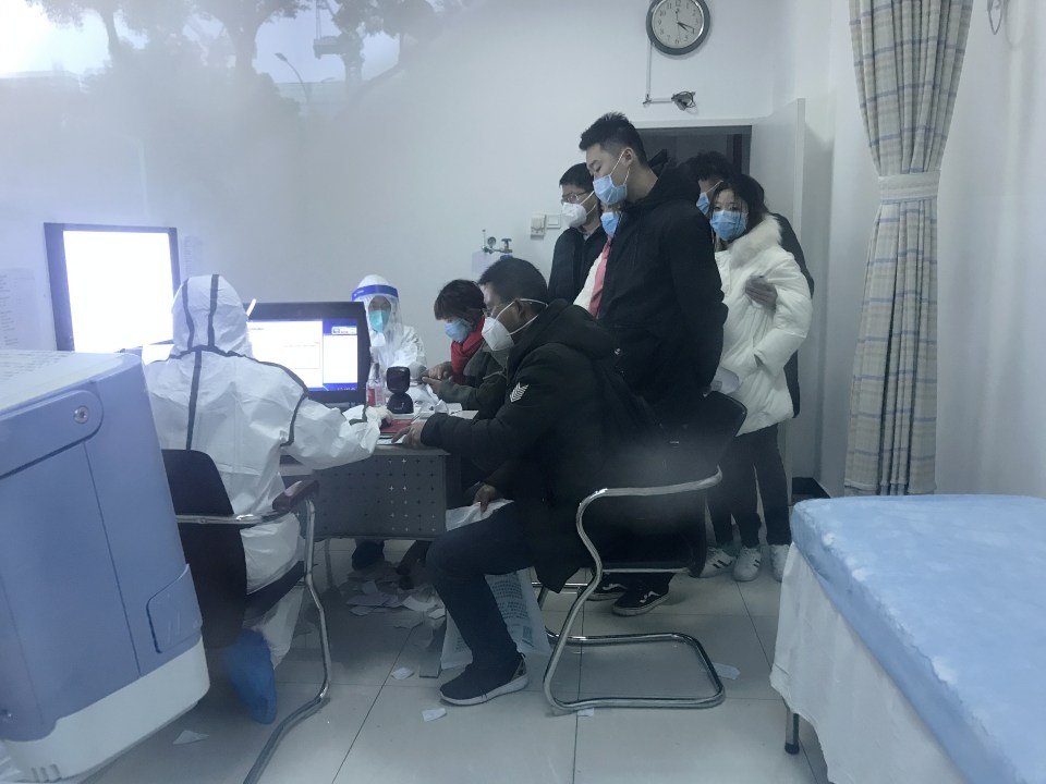  Patients queue up in Wuhan for treatment as China grapples to contain the coronavirus outbreak