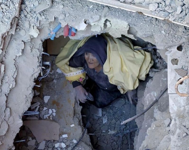  A woman is rescued from the quake rubble