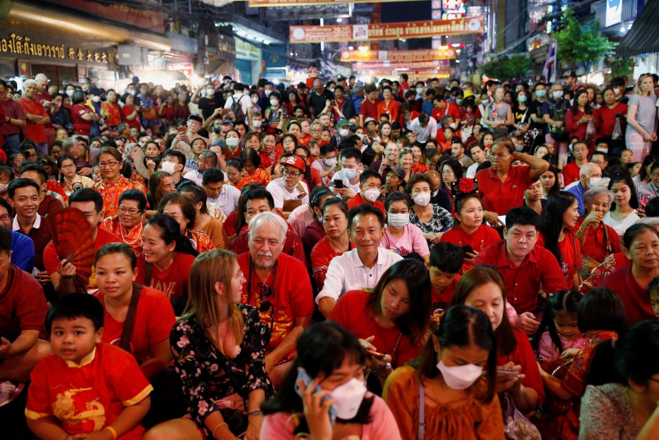  People wear masks as they celebrate the Chinese New Year in Thailand